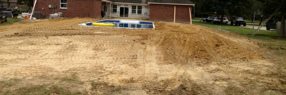 New swimming pool with pool installed and new dirt work